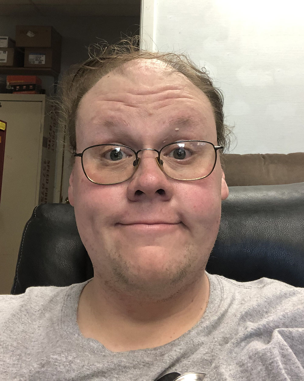 Matt Walkosz, MNCBA Volunteer Coordinator, in his office at Speed Print, Inc. photo of Matt sitting in an office chair with a file cabinet in the background
